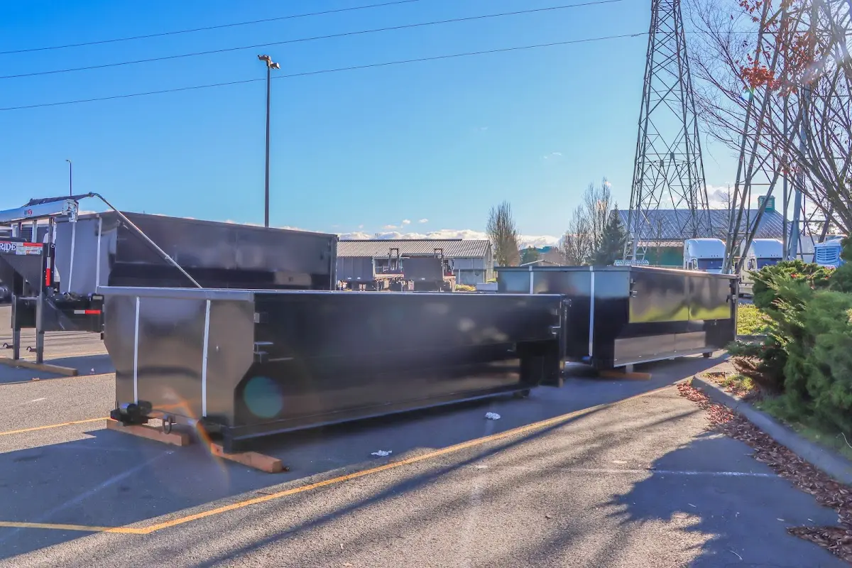 Roll-off dumpster ready for waste disposal at job site for Concrete Dumpster Rental in Fostoria